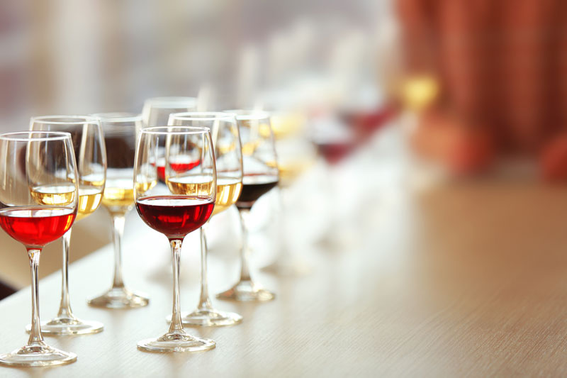 Many Glasses Of Different Wine In A Row On A Table