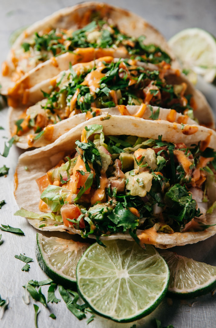 Three Fish Tacos With Lettuce, Tomato, Onion And Lots Of Cilantr